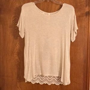 Small tan and white short sleeve shirt.